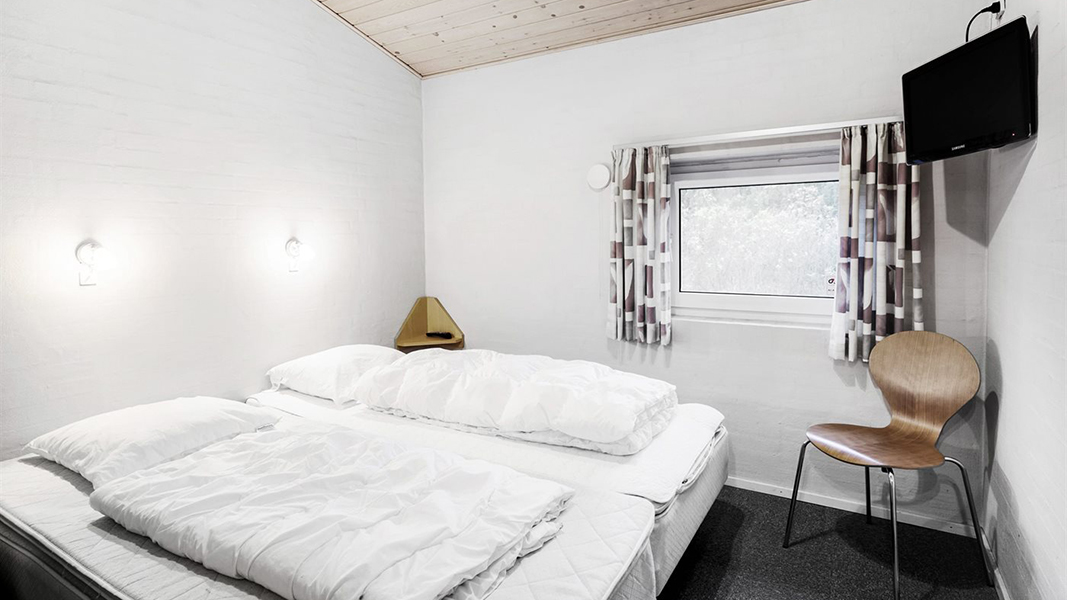 Schlafzimmer in Poolhus Søndervig