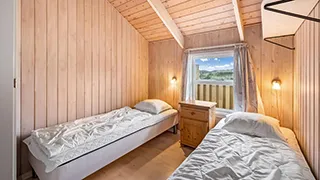 Schlafzimmer in Poolhus Traditionell