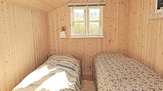 Schlafzimmer in Sommerhus på Bakken