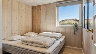Schlafzimmer in Poolhus i klitterne