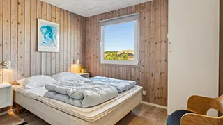 Schlafzimmer in Poolhus i klitterne