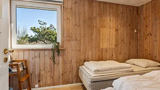 Schlafzimmer in Poolhus i klitterne