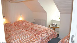 Schlafzimmer in Hus Vestklit
