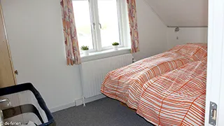 Schlafzimmer in Hus Vestklit