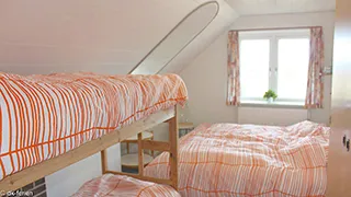 Schlafzimmer in Hus Vestklit