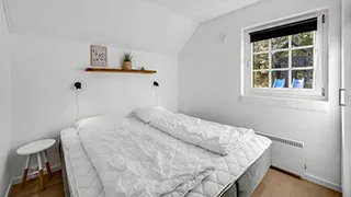 Schlafzimmer in Krattet Poolhus