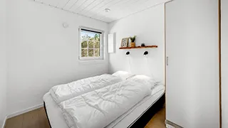 Schlafzimmer in Krattet Poolhus