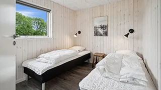 Schlafzimmer in Bellevue Poolhus