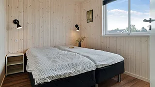 Schlafzimmer in Moselund Poolhus