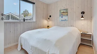 Schlafzimmer in Solsikke Poolhus