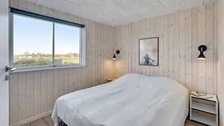 Schlafzimmer in Sneugle Poolhus