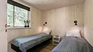 Schlafzimmer in Højbro Poolhus