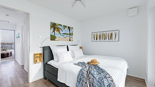 Schlafzimmer in Haus mit Strandkorb Idyll